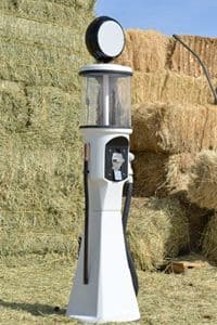 White fiberglass charging tower in front of hay bales