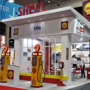 Shell trade show booth with yellow replica gas pumps